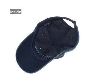 Detailed inside view of navy cotton baseball cap showing stitching and metal buckle