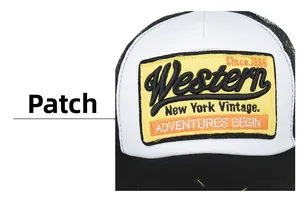 Close-up of the vintage embroidered cloth label on the black and white mesh trucker hat