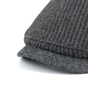 Men winter wool herringbone newsboy cap in dark grey with striped texture and metal detail