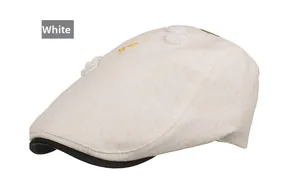 Detail of white cotton newsboy cap featuring yellow flower embroidery and 3D bow accent