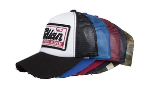 Detail of vintage trucker hats showing mesh back, embroidery patch and distressed brim