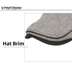 Detailed close-up of the grey knit fabric visor with black piping on the casual cap