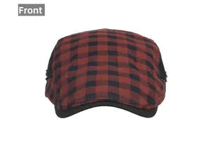 Détail de face d'une casquette gavroche à carreaux rouges et noirs texturés