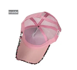 Inside view of pink sequin trucker hat featuring breathable mesh and adjustable snapback