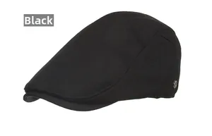 Detailed macro shot of black flat cap fabric texture with a silver metal buckle