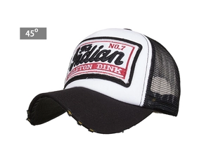 Detail of vintage truck hat with embroidered patch and distressed brim texture
