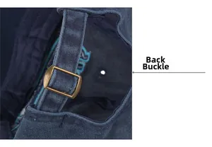 Detailed close-up of the adjustable bronze metal buckle on the dark blue cotton baseball cap