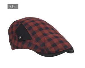 Détail d'une casquette gavroche rétro à carreaux rouges et noirs avec bouton en métal