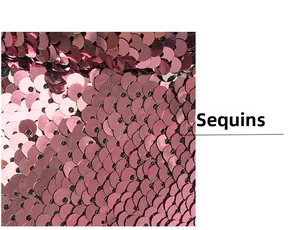 Macro close-up of overlapping rose gold sequins on a baseball cap with metallic luster