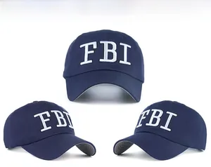 Three-angle views showing white 3D embroidered FBI lettering on navy cotton baseball cap