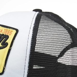 Black and white washed cotton mesh baseball cap featuring yellow 1885 embroidery detail