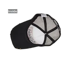 Internal details of black trucker hat showing mesh panels and product care labels