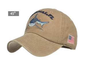 Detail of embroidered shark design and American flag patch on khaki cotton baseball cap