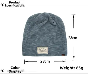 Blue knit beanie with ROCK woven label showing 28cm dimensions and 65g weight