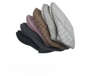 Close-up showing striped and herringbone texture details of colorful newsboy caps