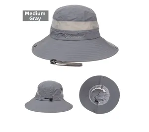 Detail view of grey sun hat showing mesh vents, wide brim, and adjustable chin strap