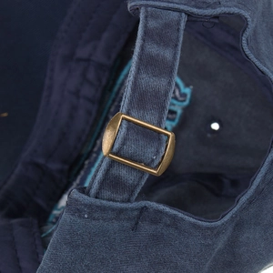 Navy blue cotton baseball cap with vintage bronze metal adjustable buckle on the back