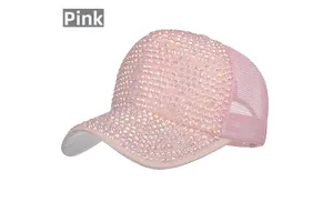 Detailed macro of pink mesh baseball cap featuring vibrant rainbow rhinestones and flat brim