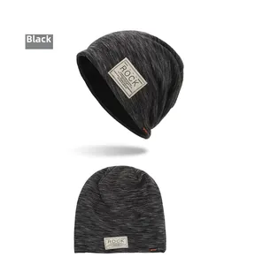 Detail view of black marl knit beanie with retro Rock patch and Sport embroidery