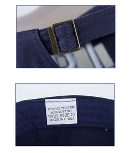 Detail of bronze metal buckle and fabric tag showing 80% cotton blend material
