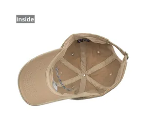 Detail view showing internal six-panel stitching and adjustable metal buckle on khaki cotton cap