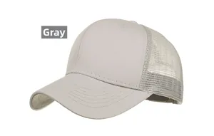 Detail view of a grey trucker baseball cap featuring breathable mesh and curved brim