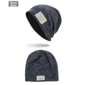 Detail view of navy blue double-layer knitted beanie with ROCK and SPORT woven labels
