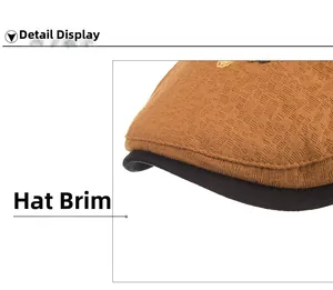 Detailed close-up showing the textured brown fabric and black trimmed brim of the cap