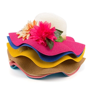 Women's summer straw sun hats with large floral accents and colorful wavy brims in stack view