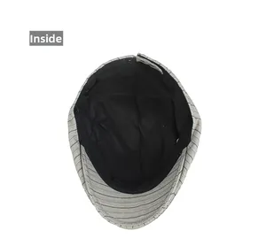 Detail view of the black striped newsboy cap interior lining and clean edge stitching