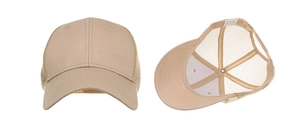 Detail view showing beige mesh trucker hat structure and cotton wash label specifics