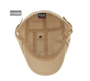 Vue intérieure de la casquette à visière kaki montrant coutures, ruban et rivet