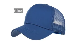 Detail view of royal blue trucker hat showing mesh back and cotton twill fabric texture