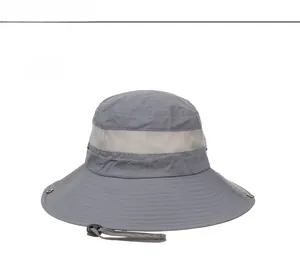 Detail of grey sun hat featuring breathable mesh crown and Outdoors embroidery text