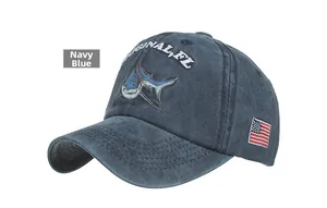 Detail of navy blue cotton baseball cap with shark embroidery and American flag patch