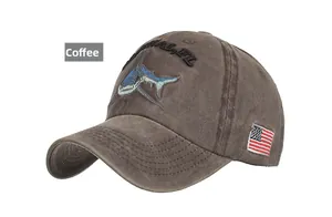 Detail of shark embroidery and American flag patch on a coffee vintage baseball cap