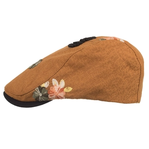 Vintage ginger yellow newsboy cap with floral embroidery and black contrast brim