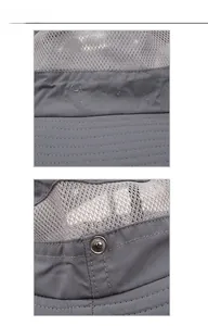 Detail of dark grey sun hat featuring Outdoors embroidery and breathable mesh stitching