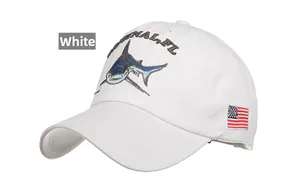 Detail of shark embroidery and American flag patch on white twill cotton baseball cap