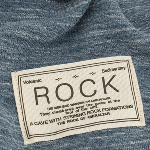 Blue knit slouchy beanie with vintage canvas label detailing for autumn winter