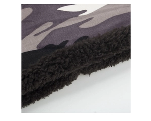 Detail of winter camouflage fabric with soft black sherpa fleece lining for warmth