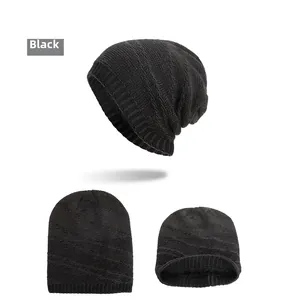 Detail of black knitted beanie showing inner fleece lining and ribbed cuff texture