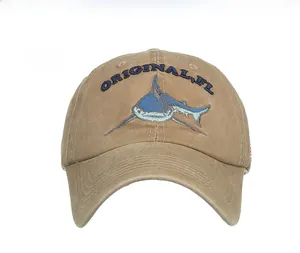 Detailed close-up of shark embroidery on khaki cotton washed baseball cap for summer
