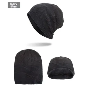 Detail view of navy blue knitted beanie showing fleece lining and ribbed cuff details