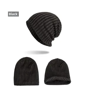 Detail view of black knit beanie featuring vertical stripe texture and thick fleece lining