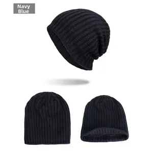 Detailed view of the navy blue ribbed knit beanie with thick fleece lining for winter warmth