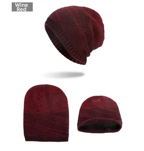 Detail of burgundy knit beanie with warm fleece lining and thick weave texture