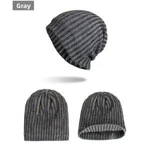 Macro detail of grey vertical ribbed knit beanie showing weave texture and interior lining