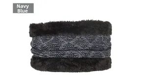 Detail of navy blue winter knit neck warmer with dark brown faux fur trim and diamond pattern