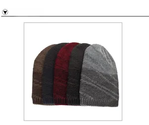 Detail view of five assorted knitted beanies featuring diagonal twill and ribbed texture
